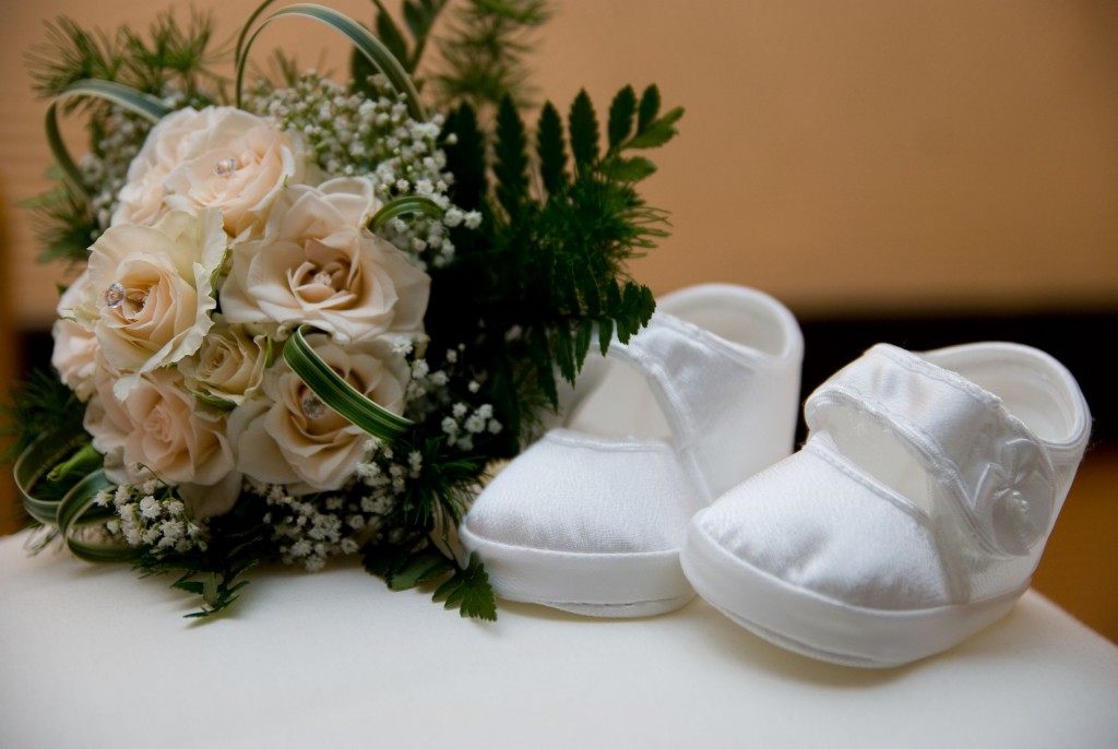 17869842 - christening shoes and bunch of roses